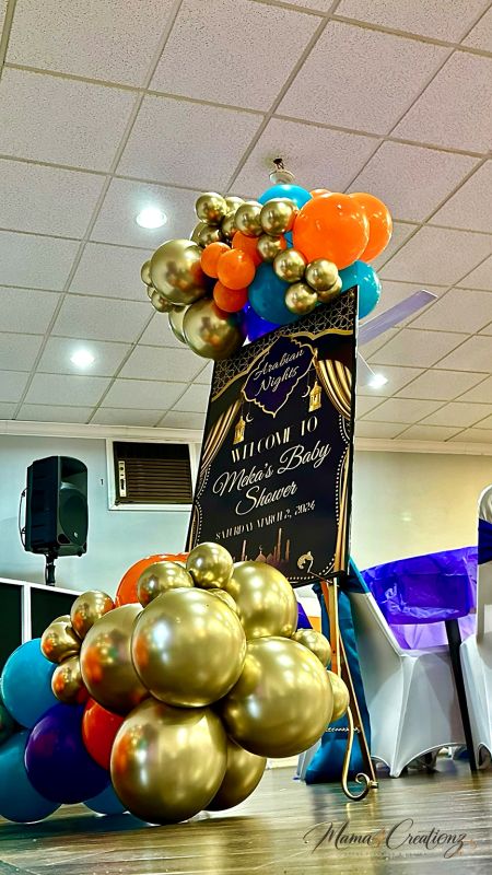 Gold sequin drape with lanterns and a Moroccan theme