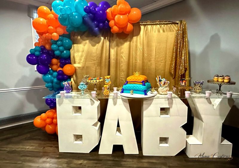 Gold sequin drape with lanterns and a Moroccan theme