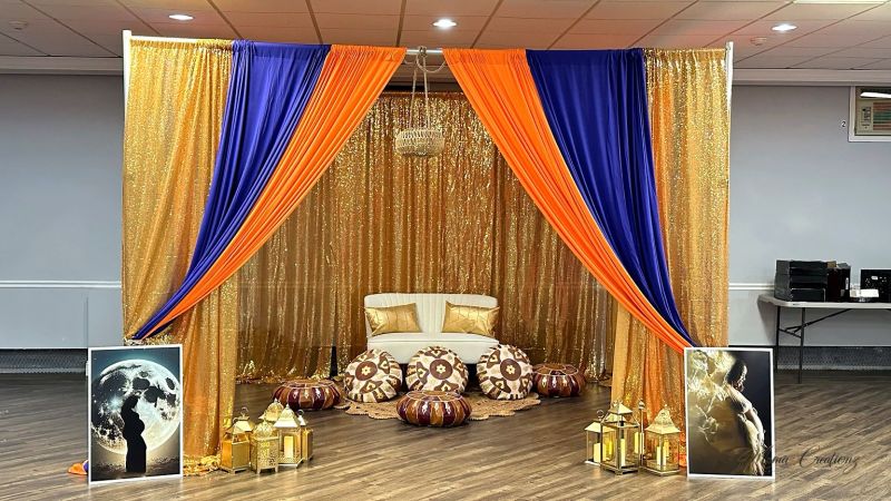 Gold sequin drape with lanterns and a Moroccan theme
