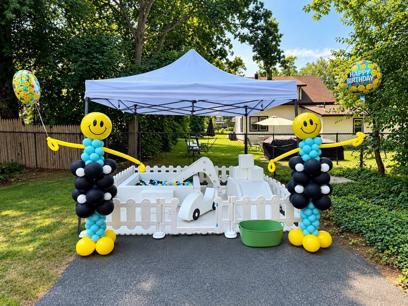 ONE Happy Dude first birthday tent with smiley balloon columns
