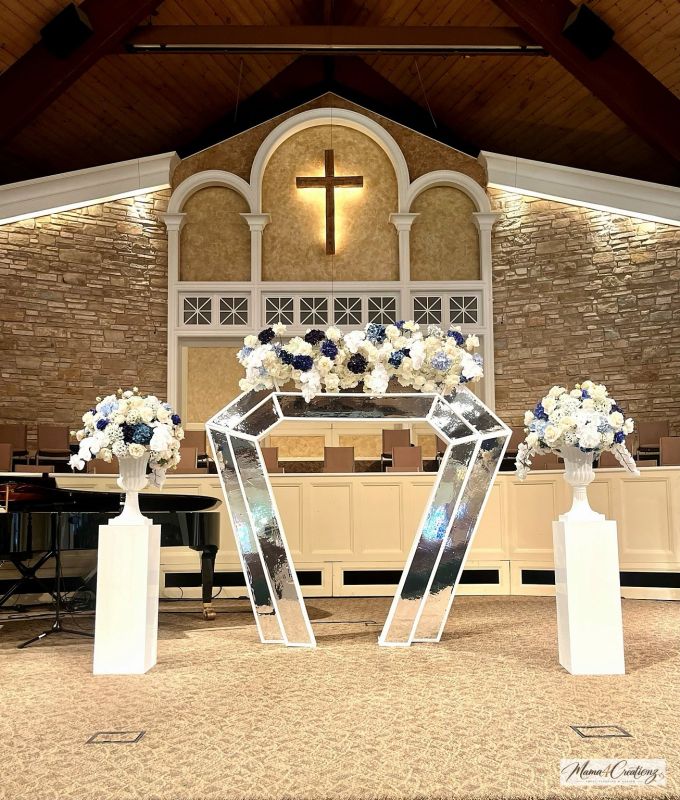 Reception hall with blue drape and a custom dance floor