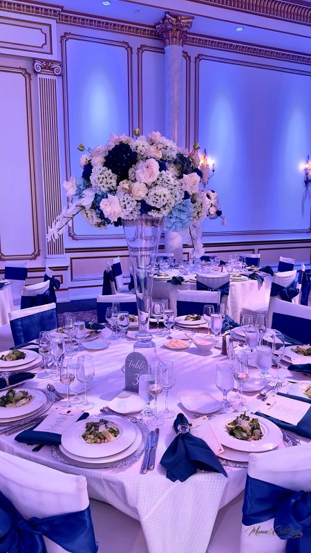 Reception hall with blue drape and a custom dance floor