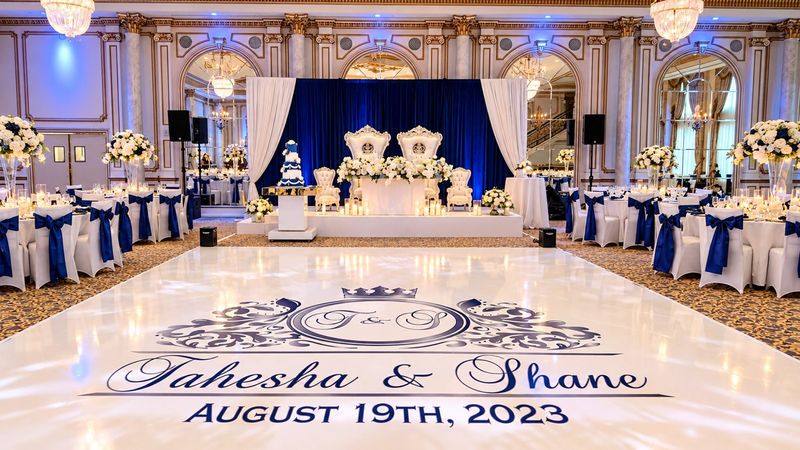 Reception hall with blue drape and custom dance floor